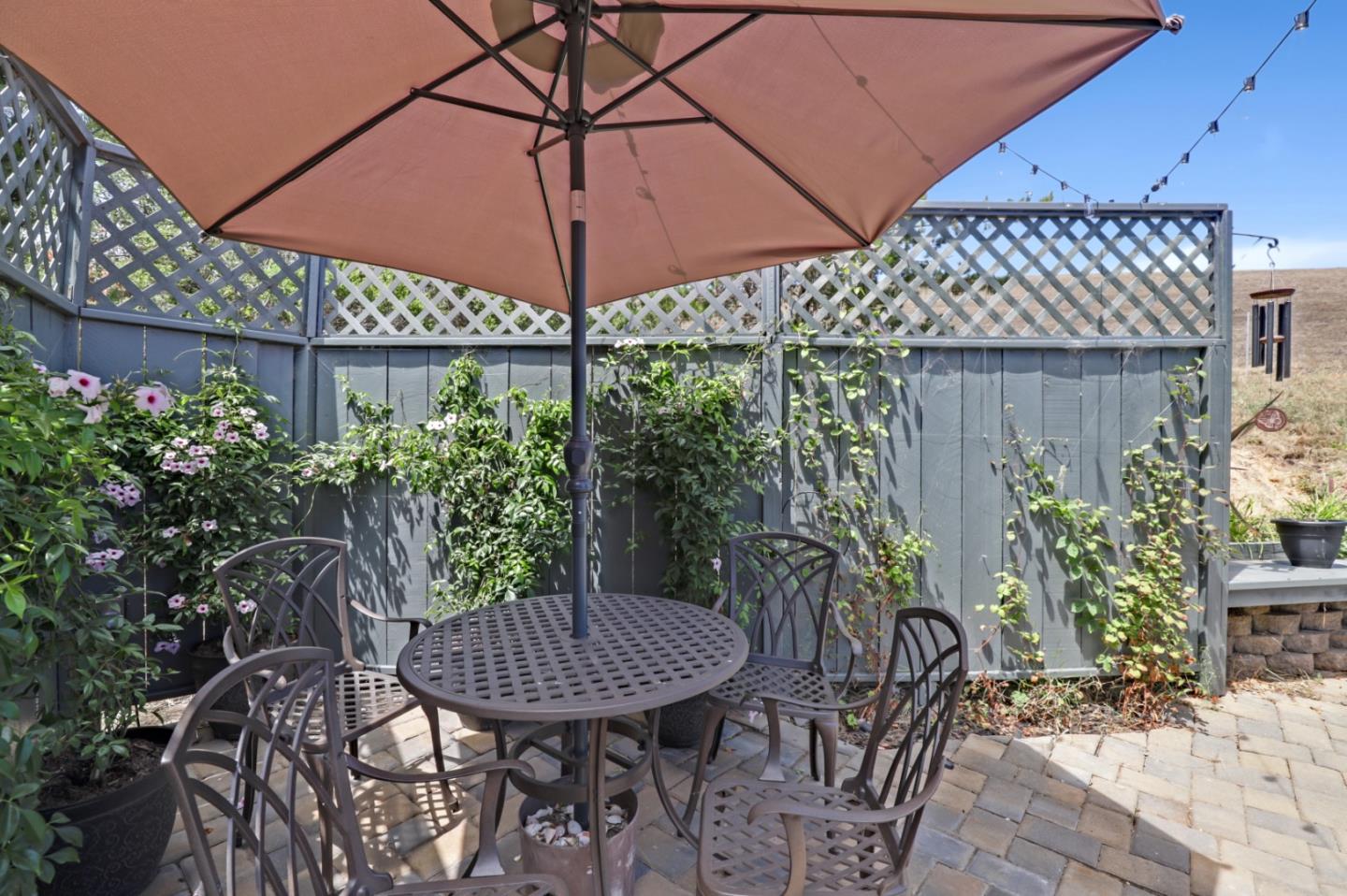 7840 Stage Road San Gregorio, CA 94074 - Photo 28 of 42 a view of a backyard with furniture and a umbrella
