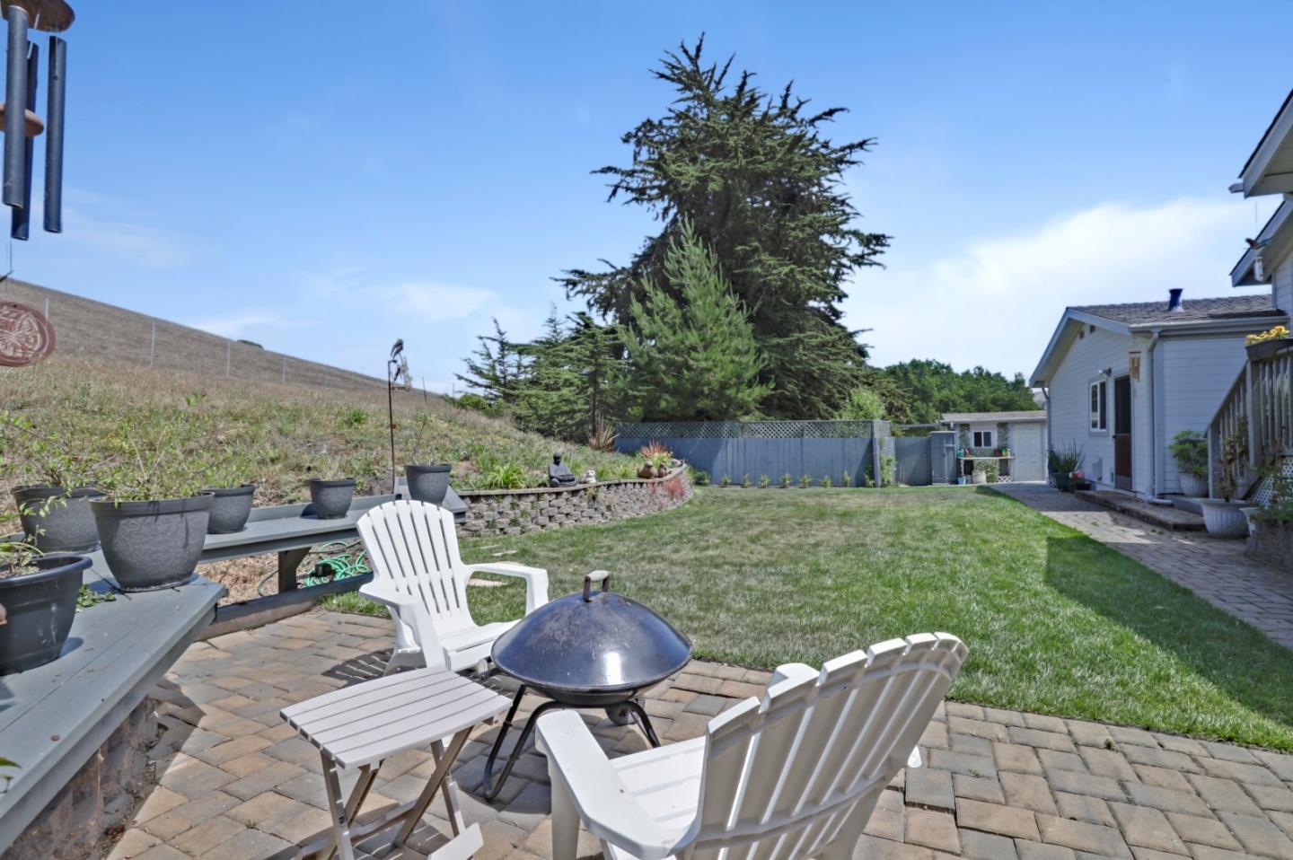 7840 Stage Road San Gregorio, CA 94074 - Photo 30 of 42 a view of a table and chairs in the garden