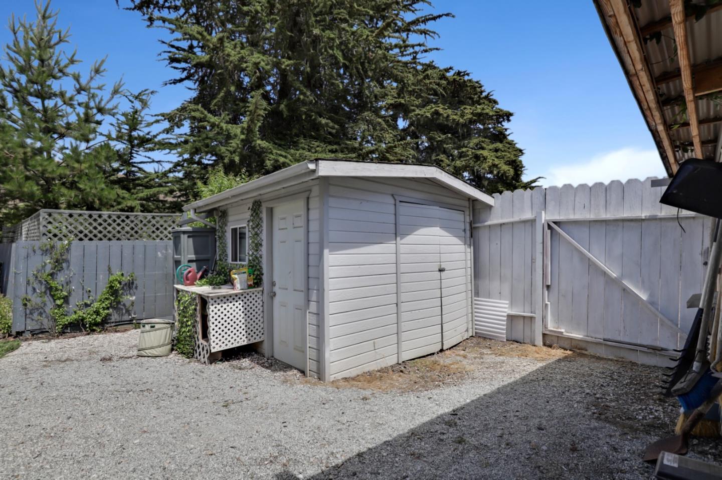 7840 Stage Road San Gregorio, CA 94074 - Photo 32 of 42 a view of a house with a backyard and garage