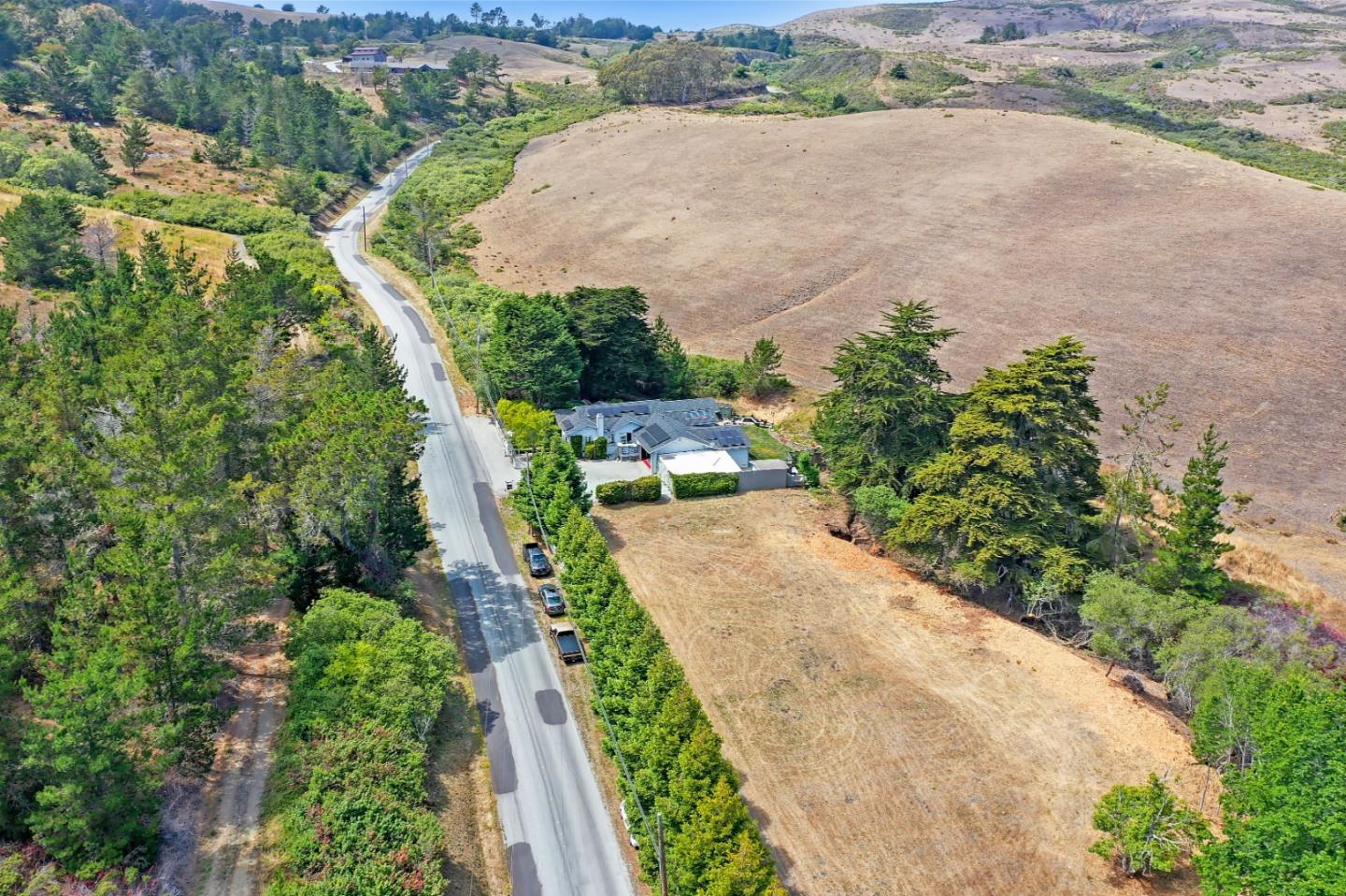7840 Stage Road San Gregorio, CA 94074 - Photo 35 of 42 an aerial view of a house with a yard and lake view