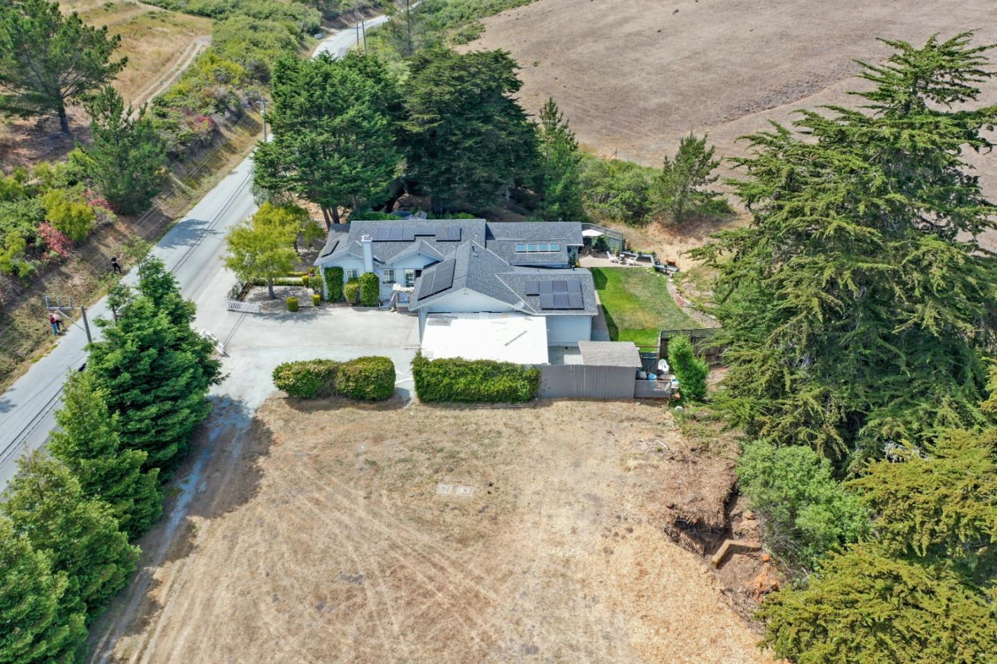 7840 Stage Road San Gregorio, CA 94074 - Photo 36 of 42 an aerial view of a house with a yard and greenery