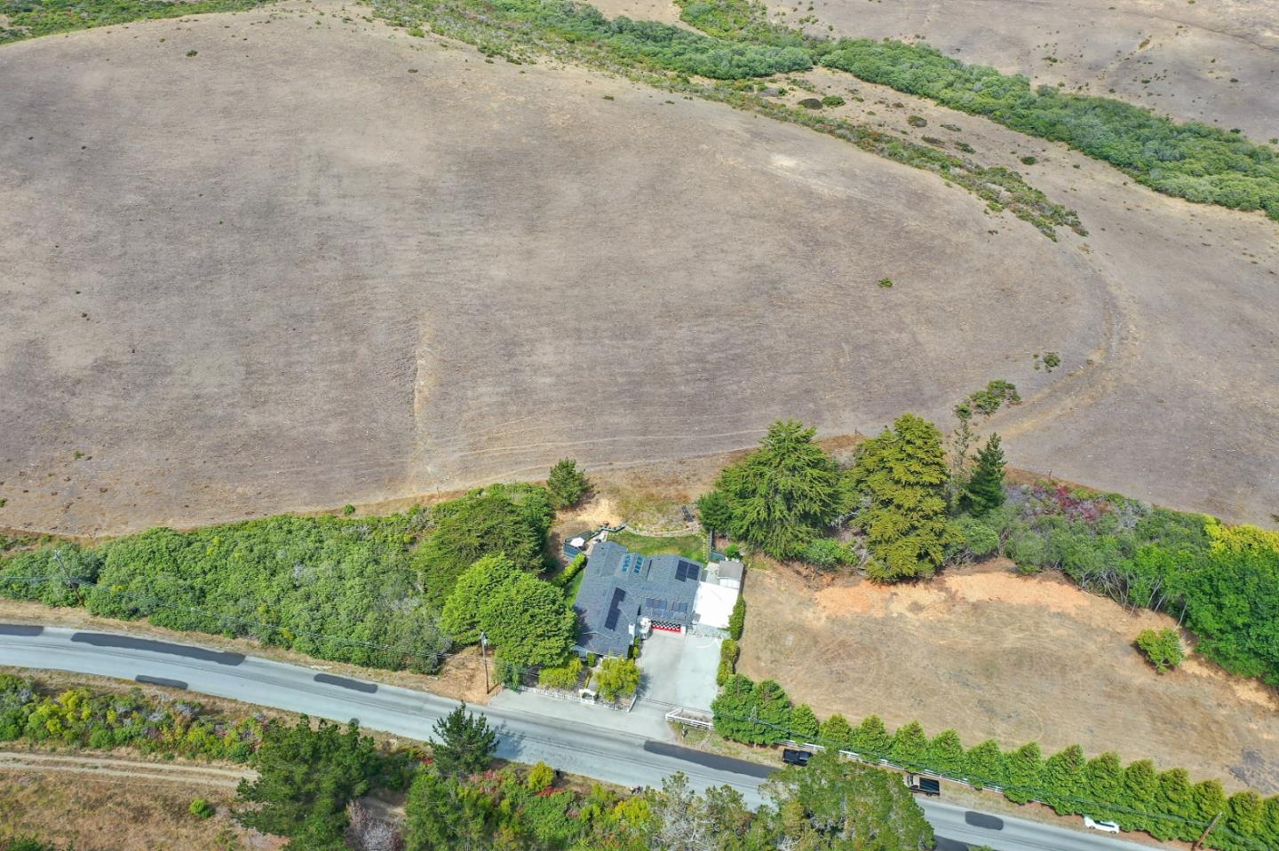 7840 Stage Road San Gregorio, CA 94074 - Photo 37 of 42 an aerial view of a house with a yard and greenery