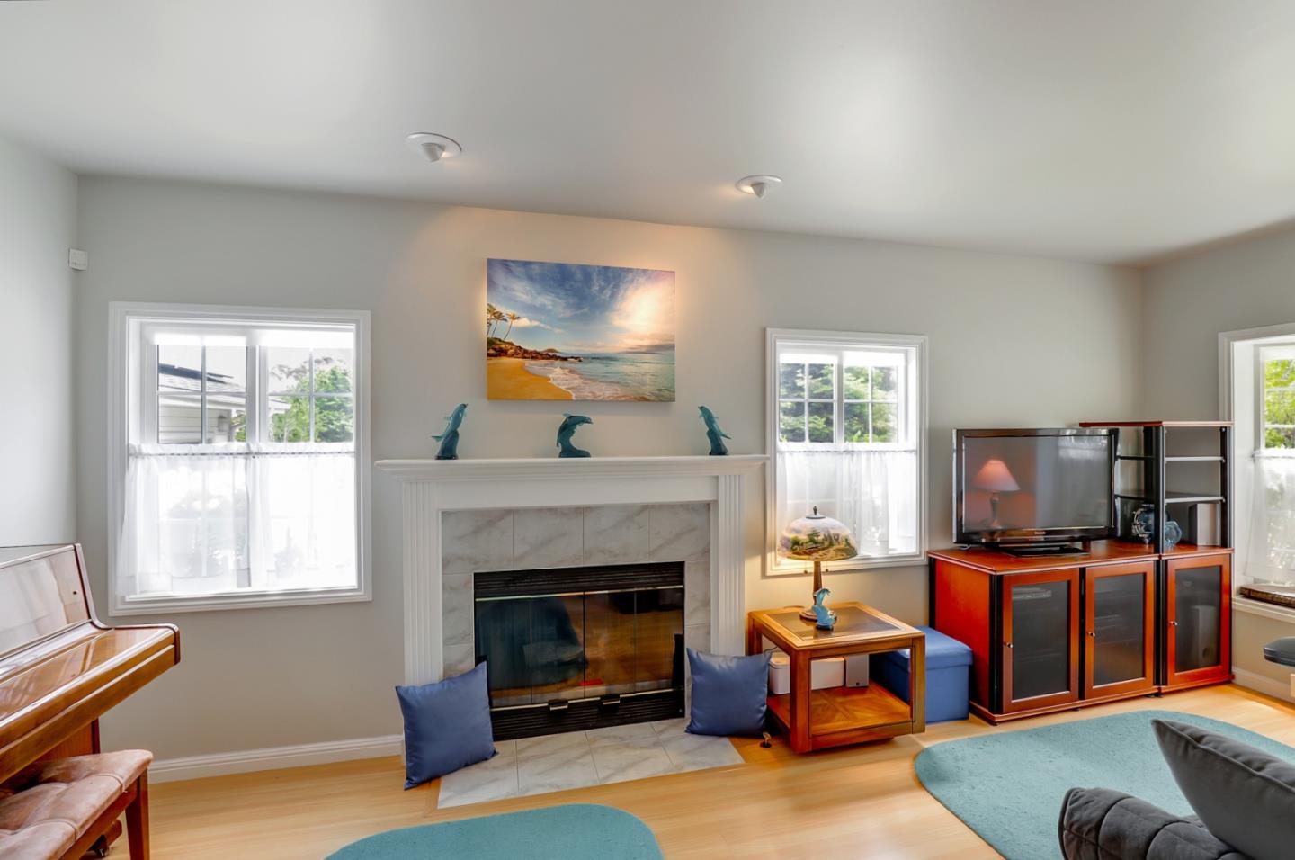 7840 Stage Road San Gregorio, CA 94074 - Photo 5 of 42 a living room with furniture a flat screen tv and a fireplace