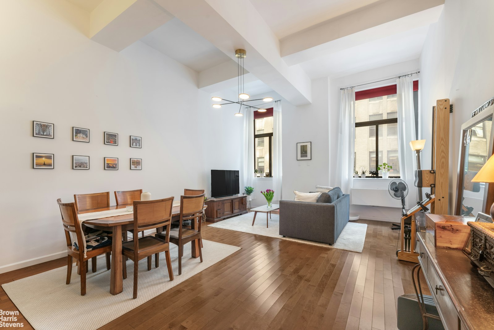 310 East 46th Street, Unit 4N Manhattan, NY 10017 - Photo 9 of 21 a view of a dining room with furniture window and wooden floor