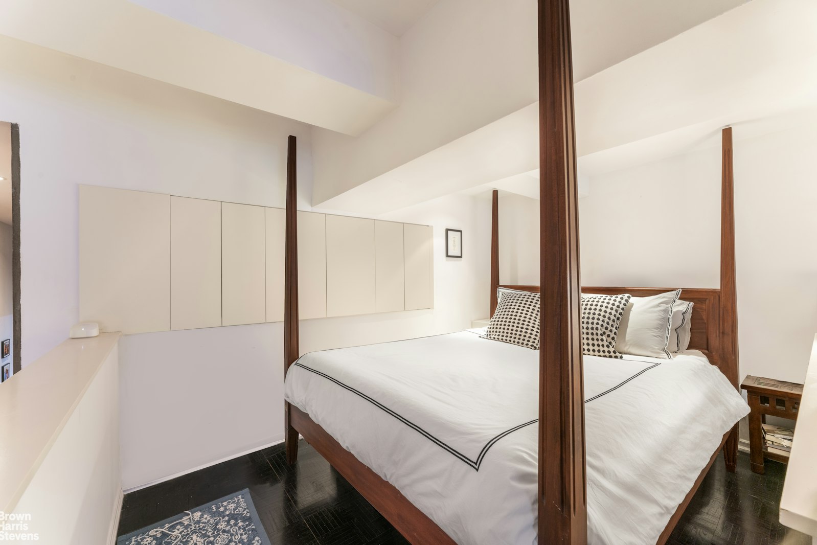 310 East 46th Street, Unit 4N Manhattan, NY 10017 - Photo 13 of 21 a bedroom with a bed and a night stand