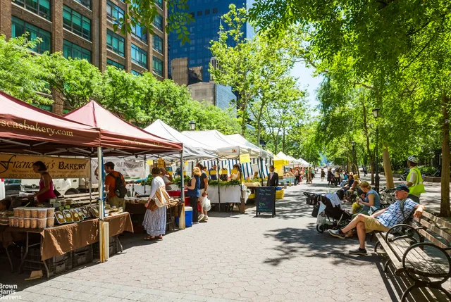 a group of people sitting outside of a house