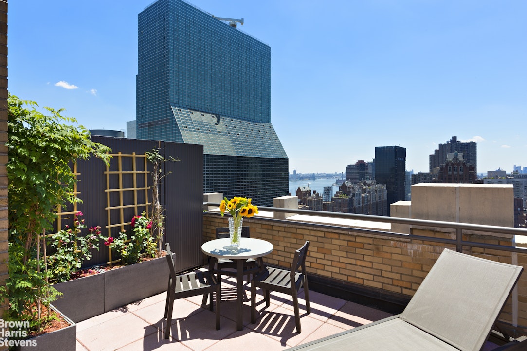 310 East 46th Street, Unit 4N Manhattan, NY 10017 - Photo 6 of 21 a view of a terrace with furniture and a potted plant