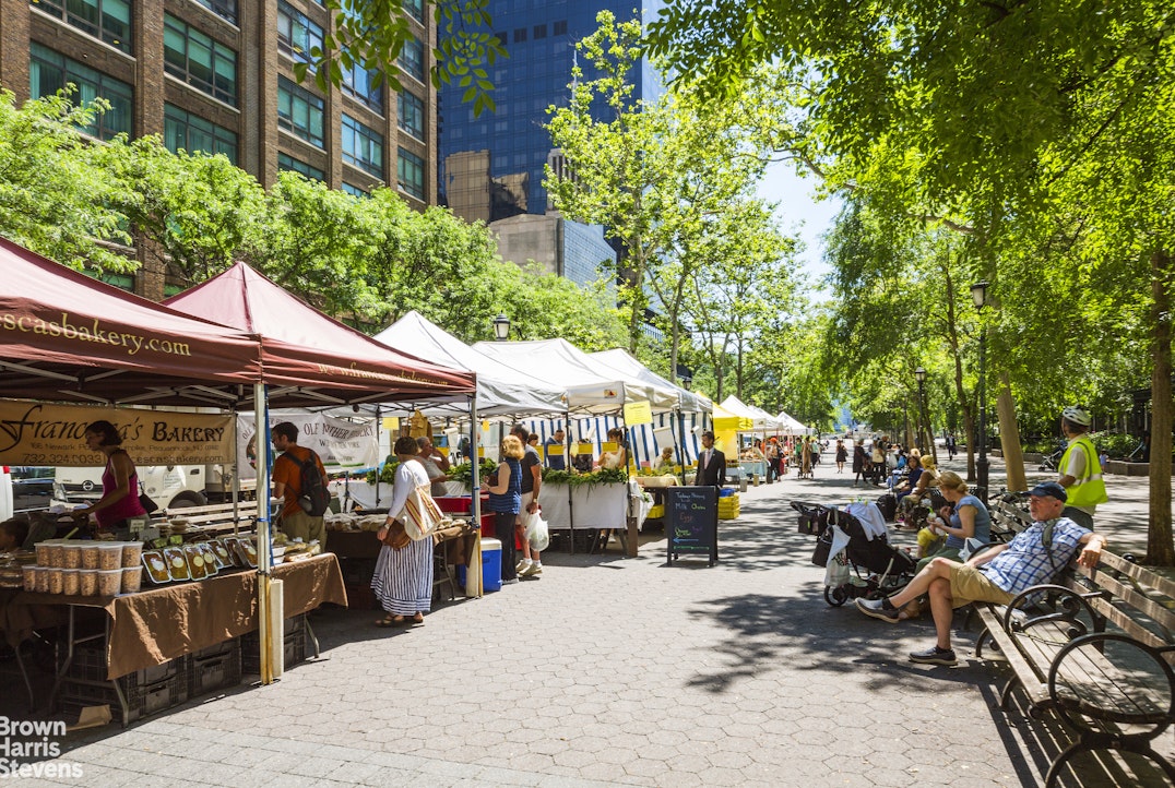 310 East 46th Street, Unit 4N Manhattan, NY 10017 - Photo 7 of 21 a group of people sitting outside of a house