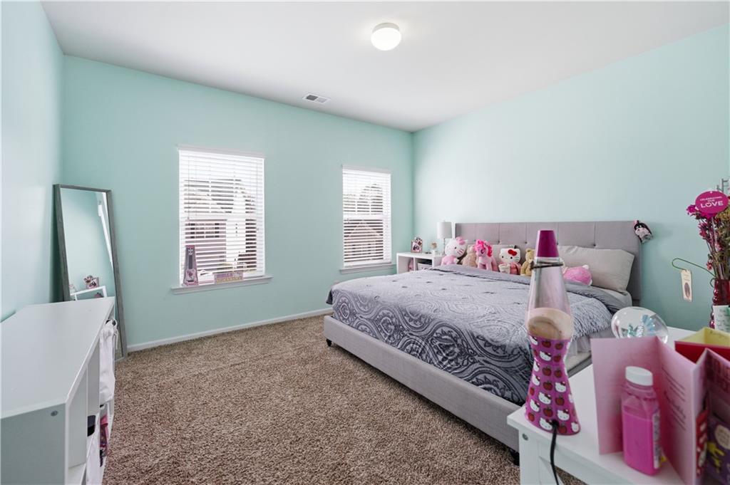 291 Boulder Run Hiram, GA 30141 - Photo 25 of 46 a bedroom with a bed and a window