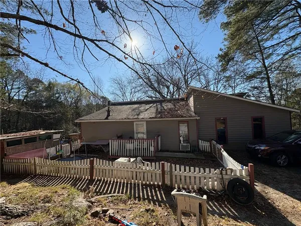a view of house with a patio