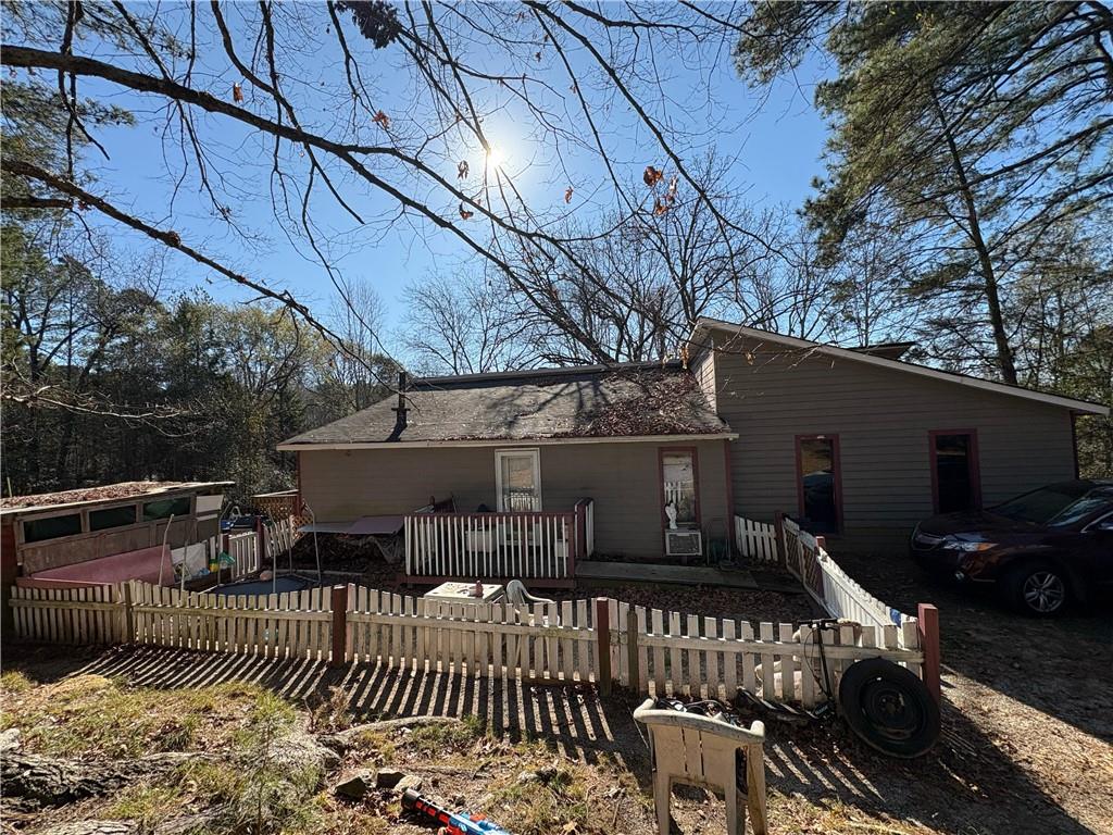 a view of house with a patio