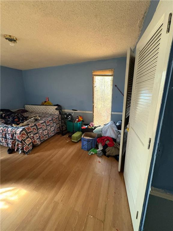 4750 Ridgewood Road Monroe, GA 30656 - Photo 12 of 23 a bedroom with a bed and a window