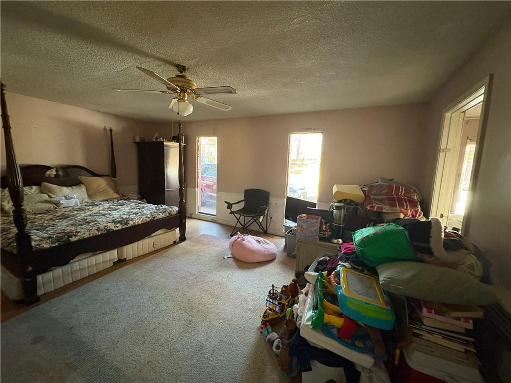 4750 Ridgewood Road Monroe, GA 30656 - Photo 4 of 23 a bedroom with furniture and a bed