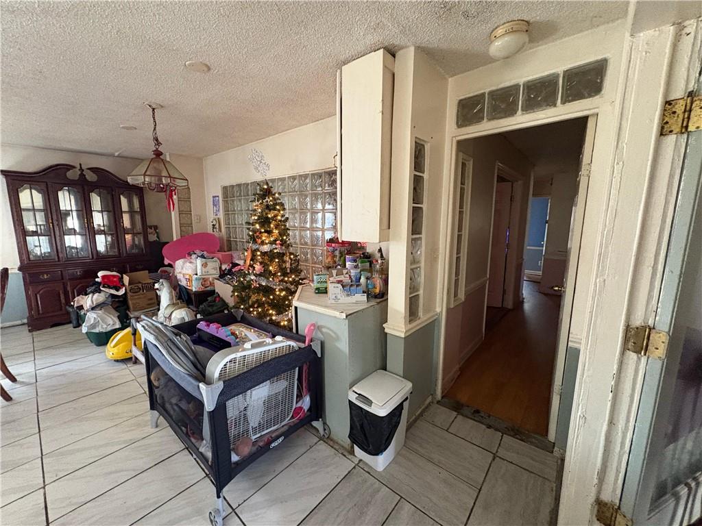 4750 Ridgewood Road Monroe, GA 30656 - Photo 8 of 23 a living room with furniture and a chandelier
