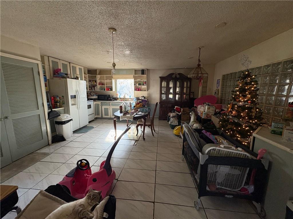 4750 Ridgewood Road Monroe, GA 30656 - Photo 9 of 23 a living room with furniture and a chandelier