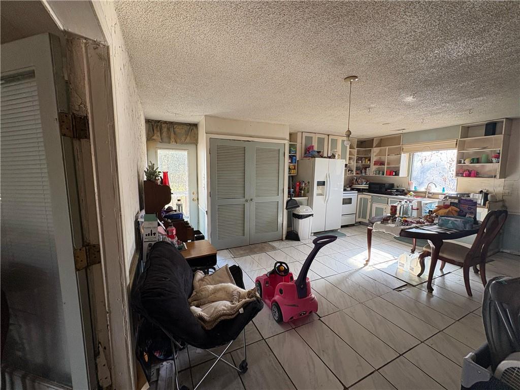 4750 Ridgewood Road Monroe, GA 30656 - Photo 10 of 23 a living room with furniture and kitchen view