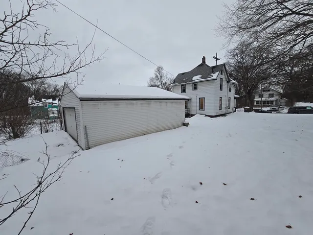 a view of garage and yard
