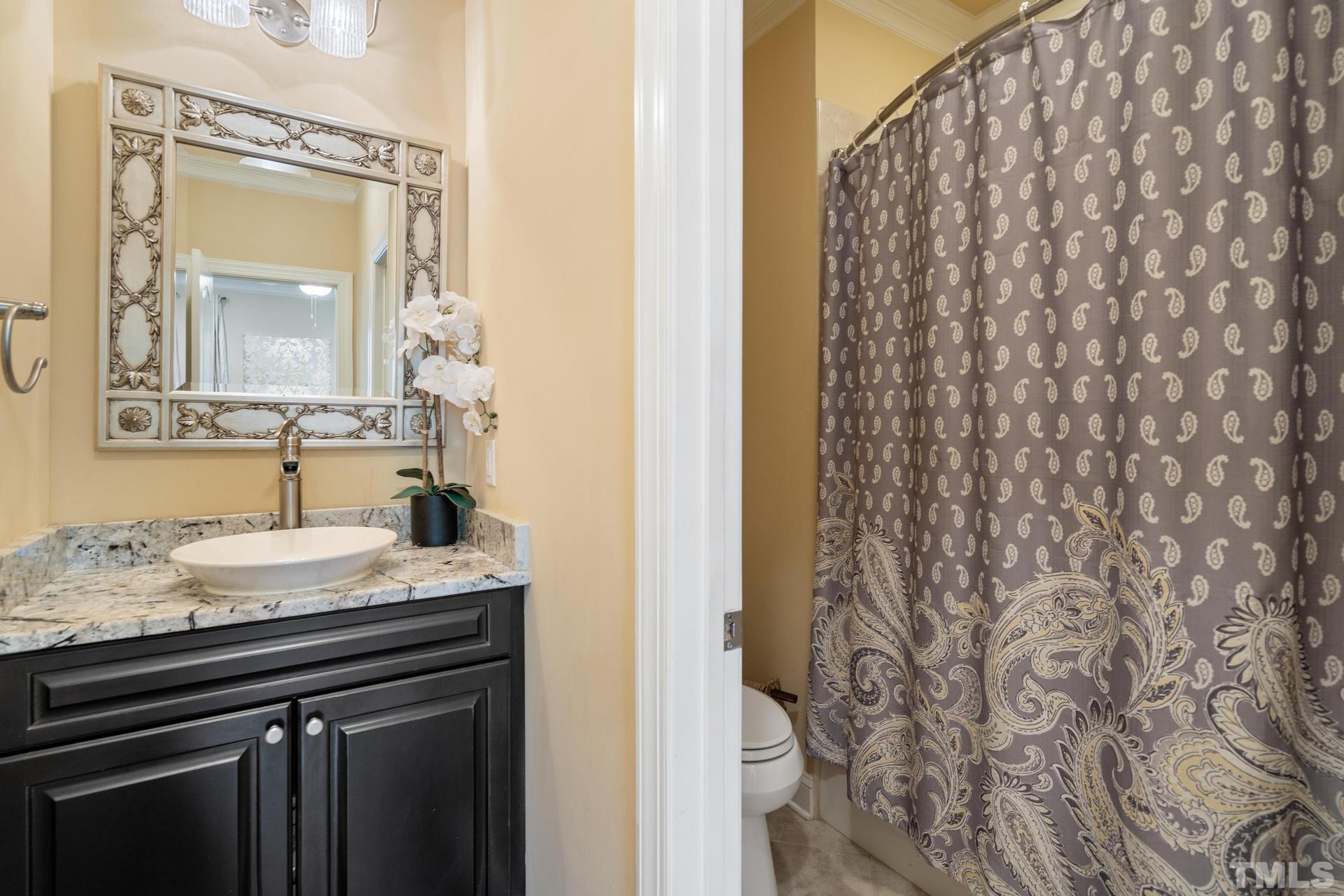 3005 London Bell Drive Raleigh, NC 27614 - Photo 15 of 73 a bathroom with a granite countertop sink and a mirror