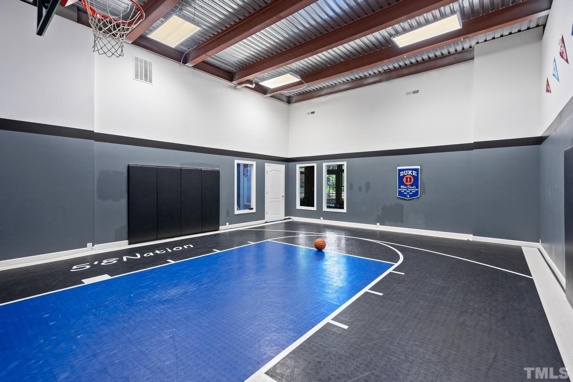 3005 London Bell Drive Raleigh, NC 27614 - Photo 18 of 73 a view of an empty room with wooden floor and a potted plant