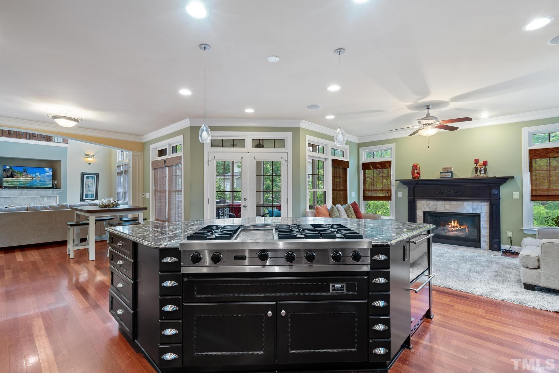 3005 London Bell Drive Raleigh, NC 27614 - Photo 21 of 73 a dining hall with stainless steel appliances granite countertop a stove and a couch