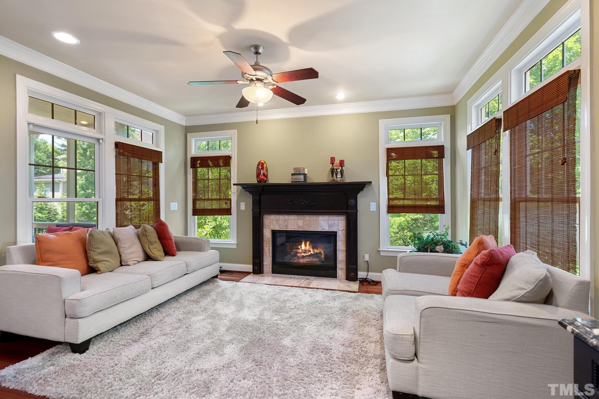 3005 London Bell Drive Raleigh, NC 27614 - Photo 23 of 73 a living room with furniture and a fireplace