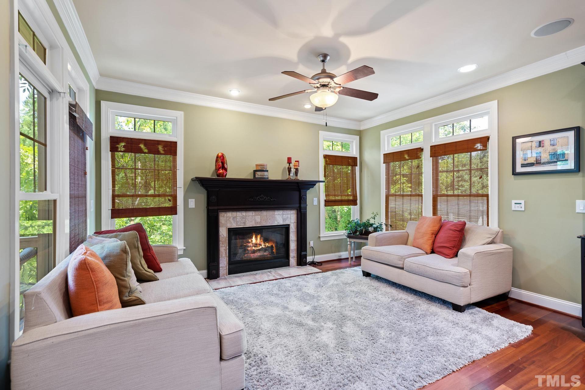 3005 London Bell Drive Raleigh, NC 27614 - Photo 24 of 73 a living room with furniture and a fireplace