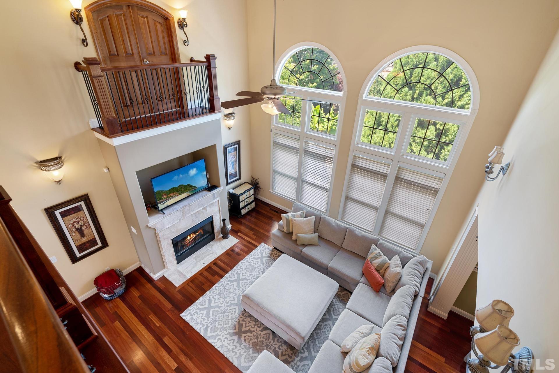 3005 London Bell Drive Raleigh, NC 27614 - Photo 33 of 73 a living room with furniture and a floor to ceiling window