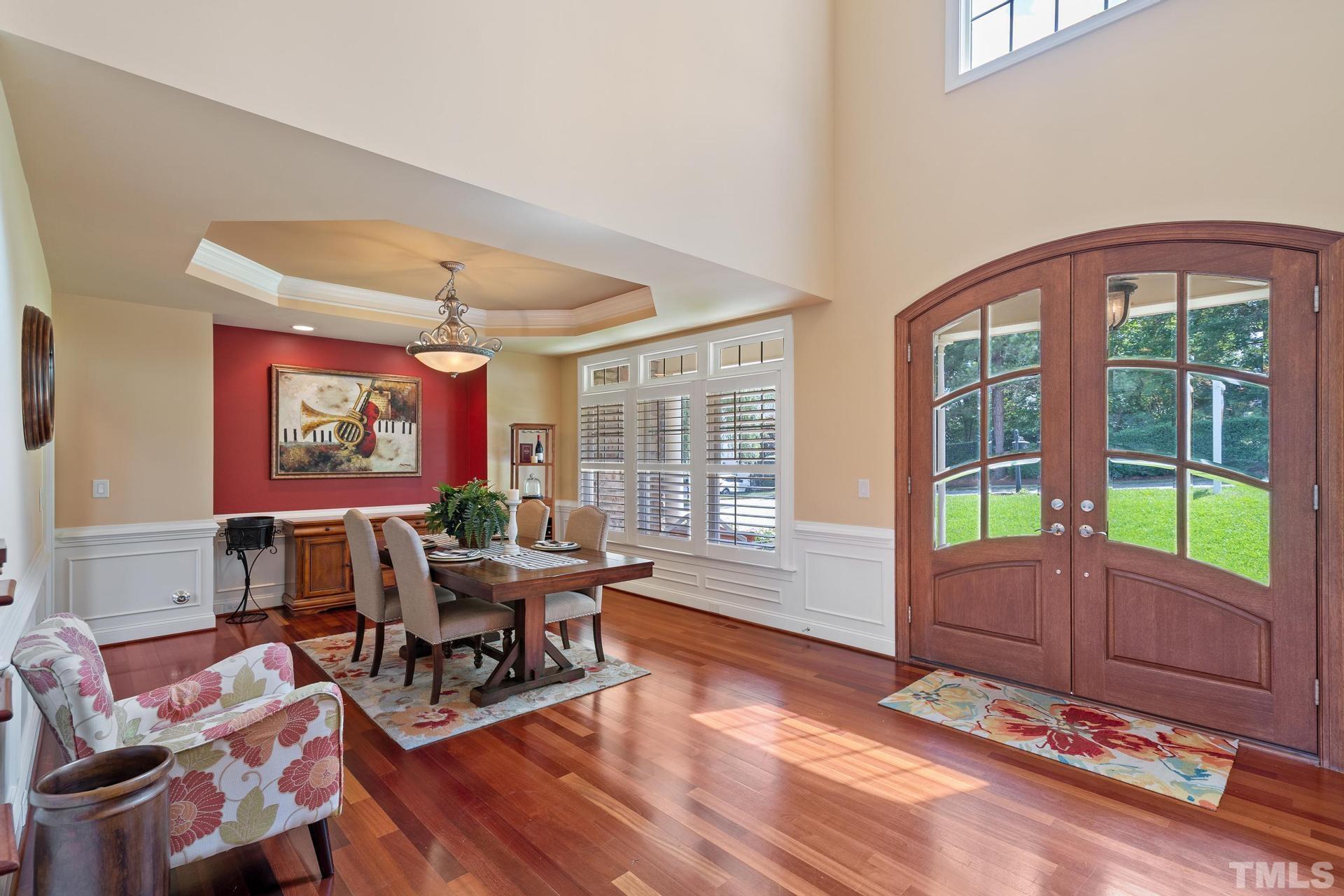 3005 London Bell Drive Raleigh, NC 27614 - Photo 35 of 73 a living room with furniture and floor to ceiling windows