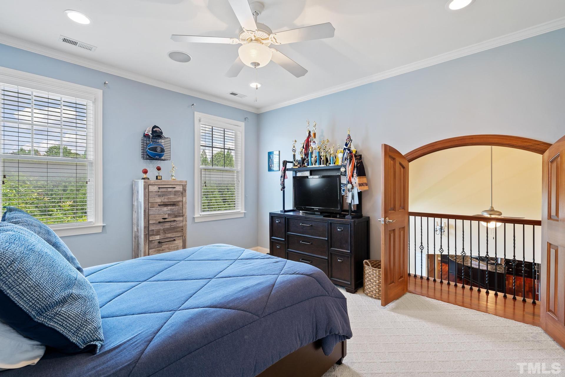 3005 London Bell Drive Raleigh, NC 27614 - Photo 39 of 73 a bedroom with a bed and a television