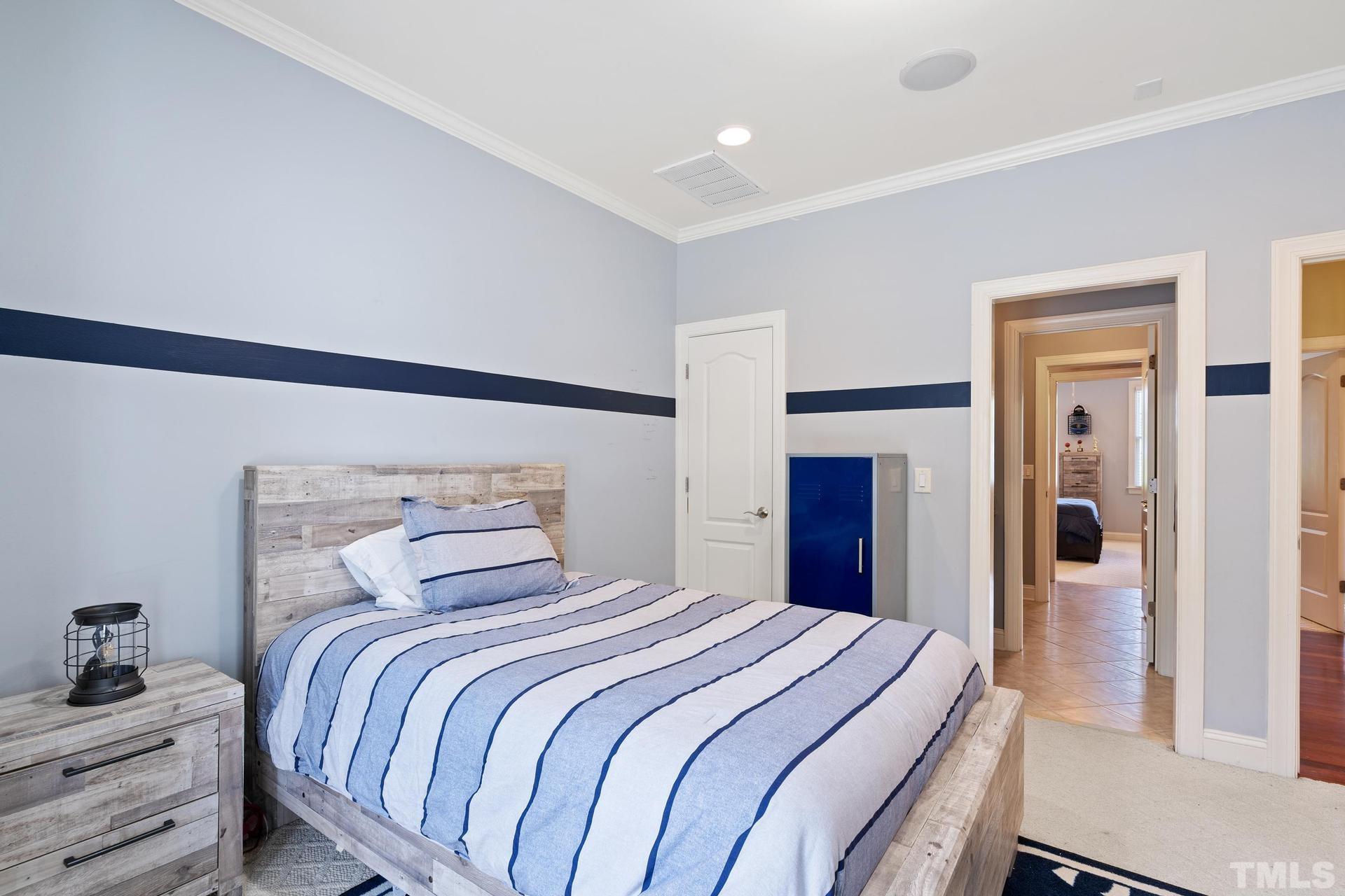 3005 London Bell Drive Raleigh, NC 27614 - Photo 42 of 73 a bedroom with a large bed and a closet