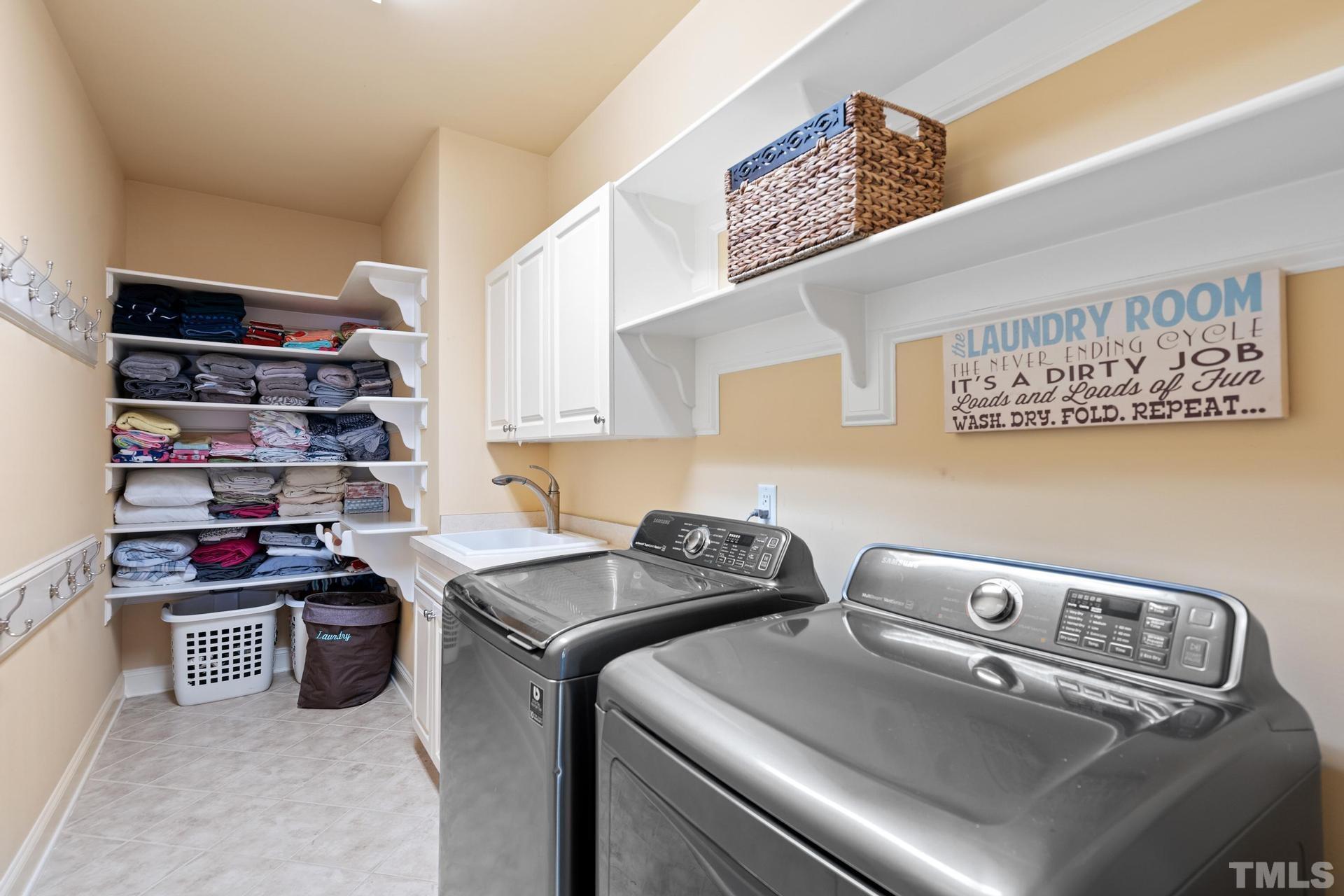 3005 London Bell Drive Raleigh, NC 27614 - Photo 56 of 73 a utility room with stainless steel appliances and cabinets