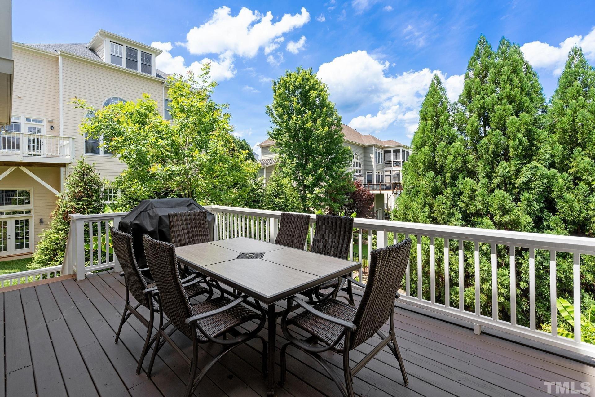 3005 London Bell Drive Raleigh, NC 27614 - Photo 59 of 73 a view of a deck with a table and chairs with wooden floor