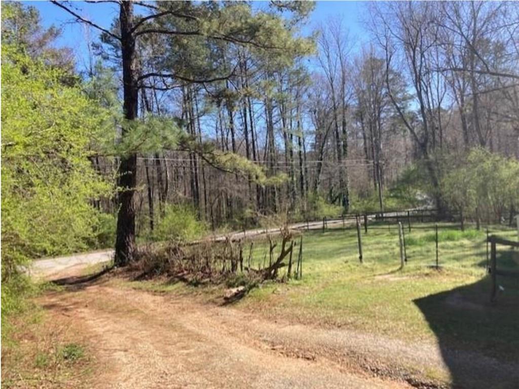 4523 Riverside Drive Southwest Lilburn, GA 30047 - Photo 12 of 12 a view of swimming pool with a yard