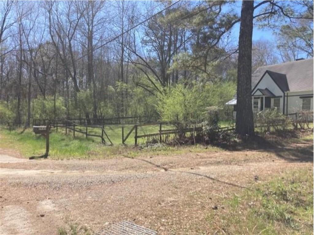 4523 Riverside Drive Southwest Lilburn, GA 30047 - Photo 2 of 12 a view of backyard of house