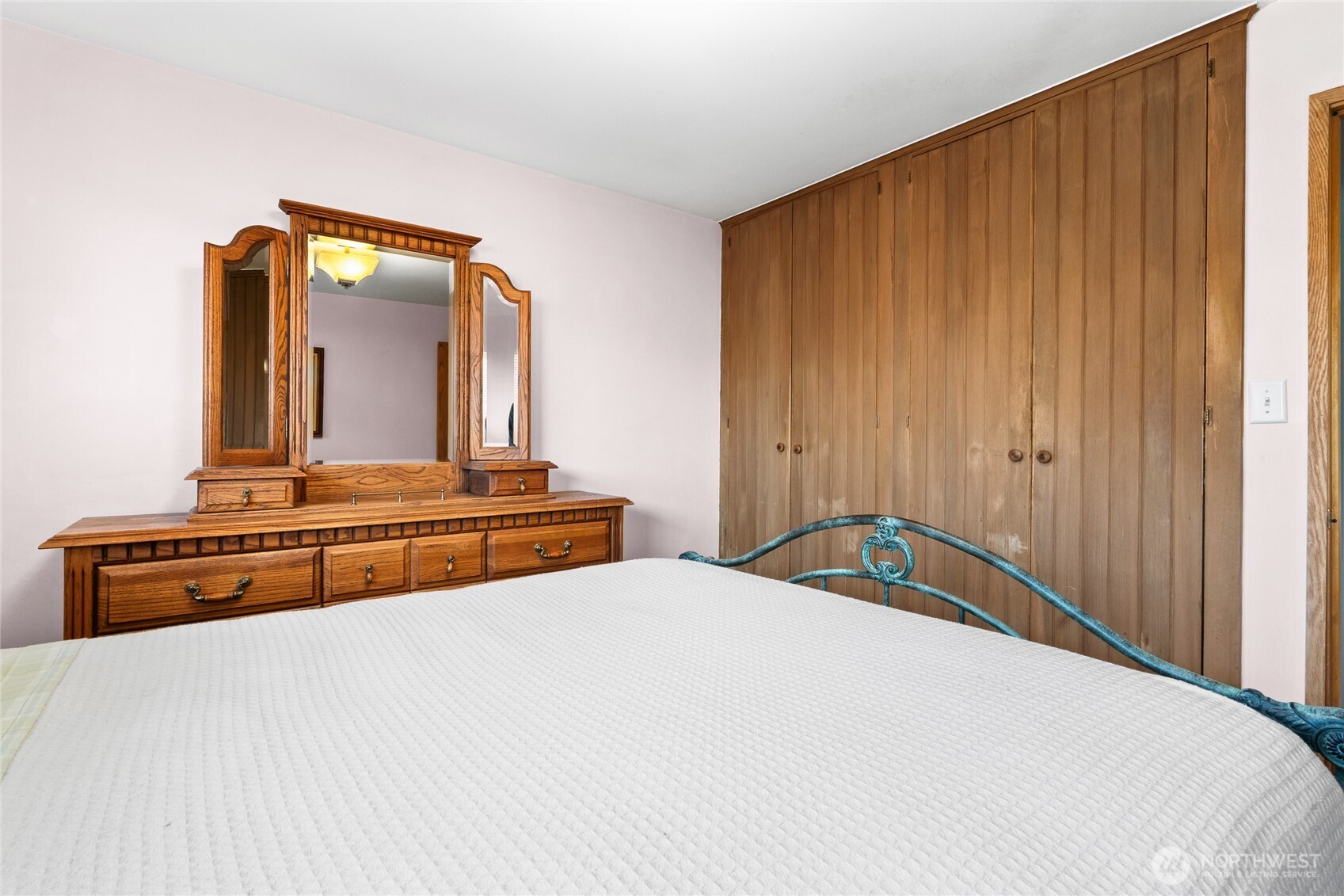 6202 224th Street Southwest Mountlake Terrace, WA 98043 - Photo 11 of 23 a bedroom with a large bed and a dresser