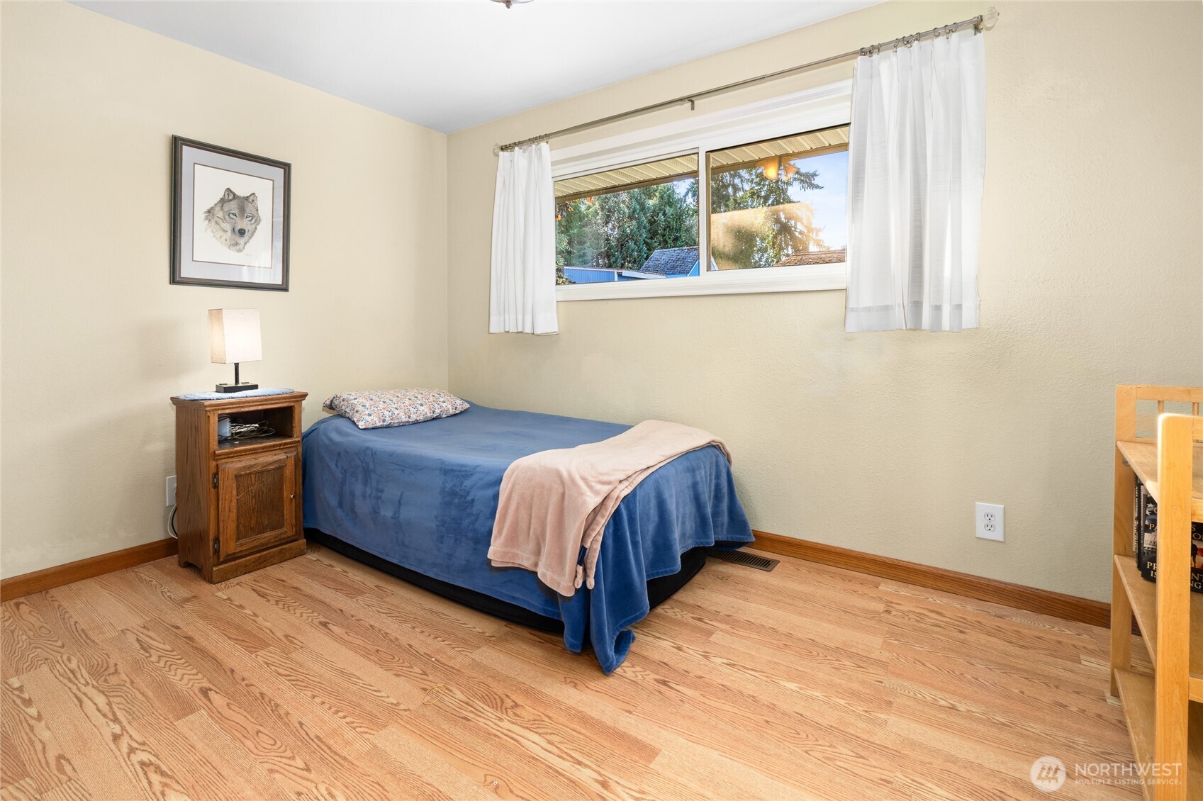 6202 224th Street Southwest Mountlake Terrace, WA 98043 - Photo 12 of 23 a bedroom with a bed lamp and a window