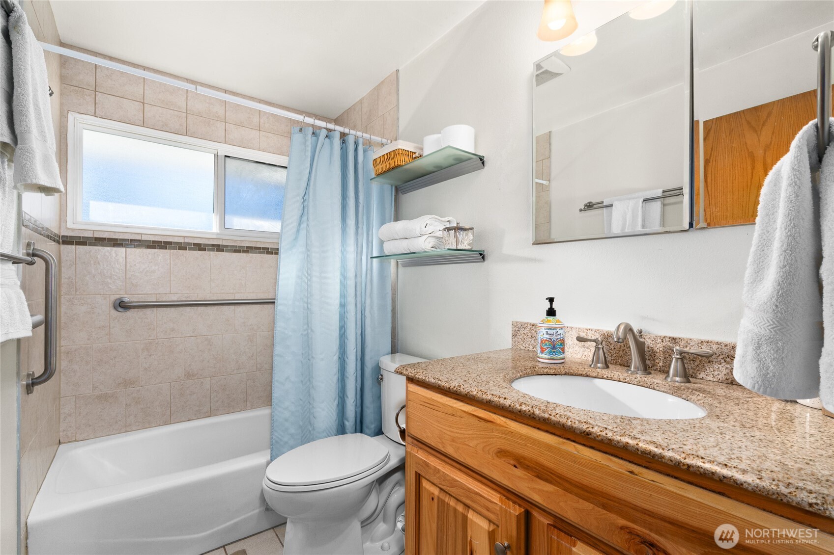 6202 224th Street Southwest Mountlake Terrace, WA 98043 - Photo 14 of 23 a bathroom with a granite countertop sink toilet and shower