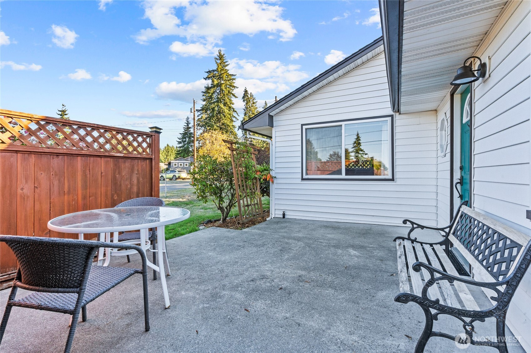 6202 224th Street Southwest Mountlake Terrace, WA 98043 - Photo 17 of 23 a backyard of a house with table and chairs