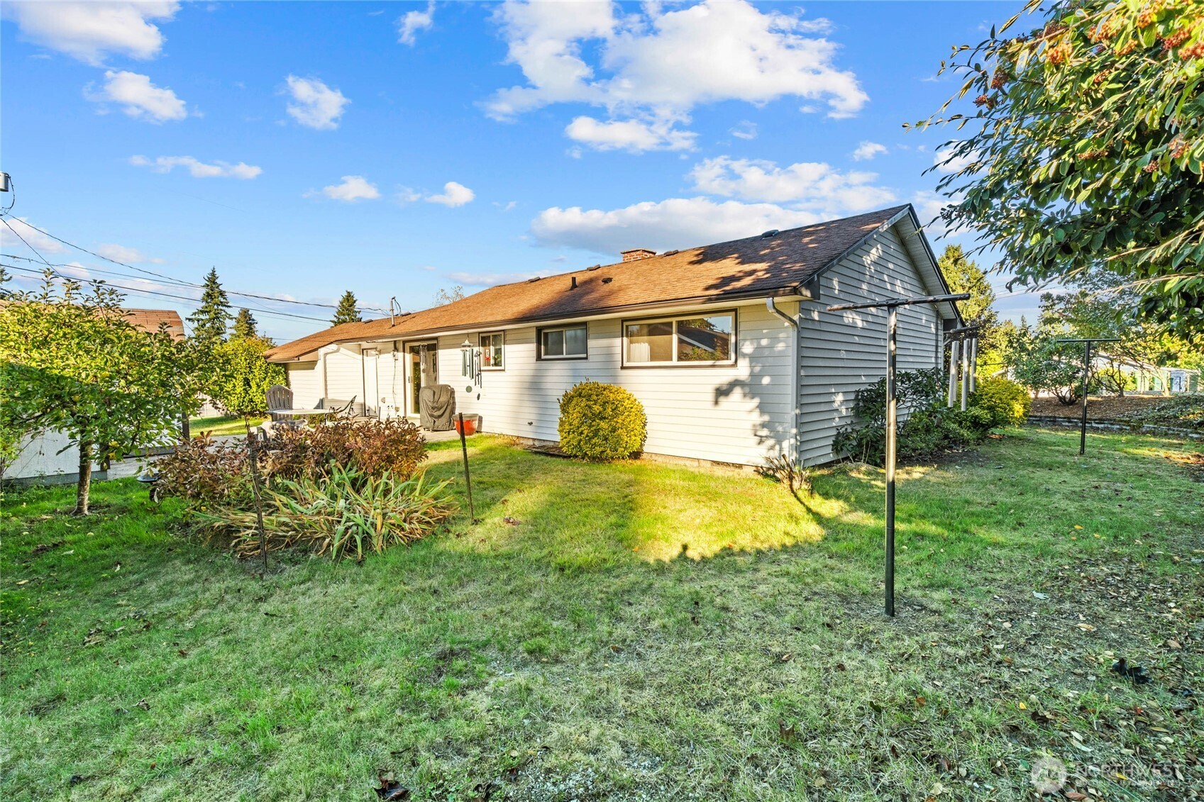 6202 224th Street Southwest Mountlake Terrace, WA 98043 - Photo 21 of 23 a view of a house with backyard and a tree