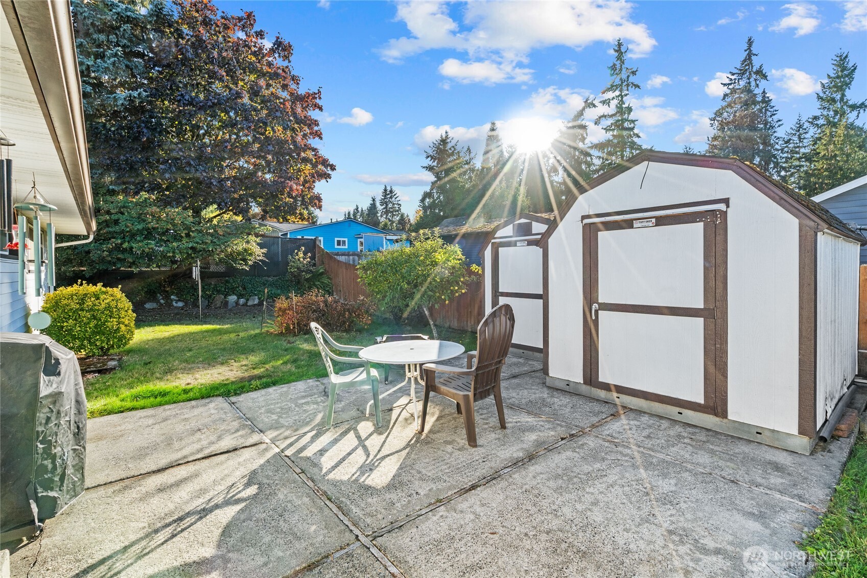 6202 224th Street Southwest Mountlake Terrace, WA 98043 - Photo 22 of 23 a view of a chair and table in backyard of the house