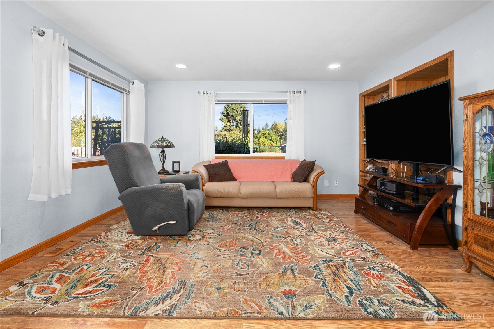 6202 224th Street Southwest Mountlake Terrace, WA 98043 - Photo 4 of 23 a living room with furniture and a flat screen tv