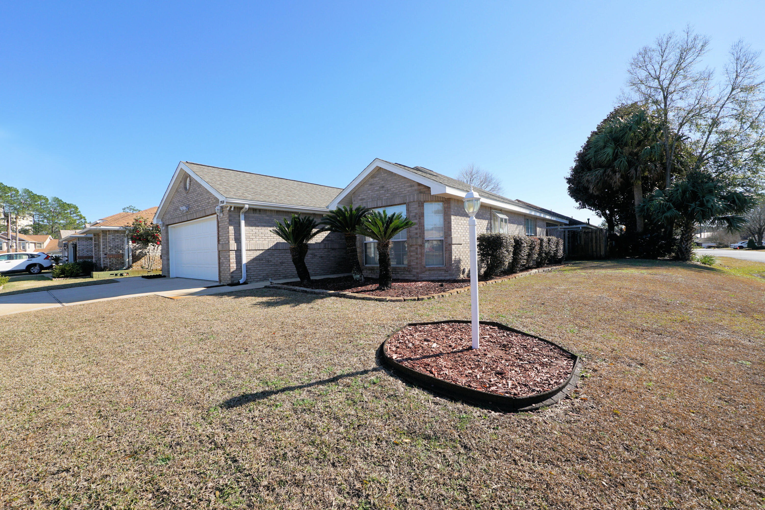 1958 Chesapeake Ridge Fort Walton Beach, FL 32547 - Photo 21 of 21 a front view of a house with a yard