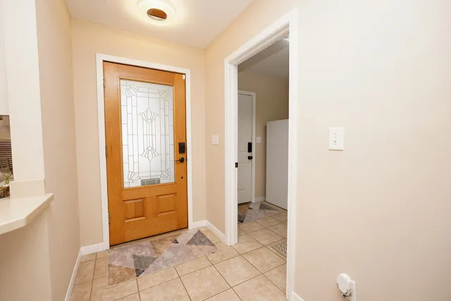 a kitchen with stainless steel appliances kitchen island granite countertop a sink dishwasher stove top oven and cabinets