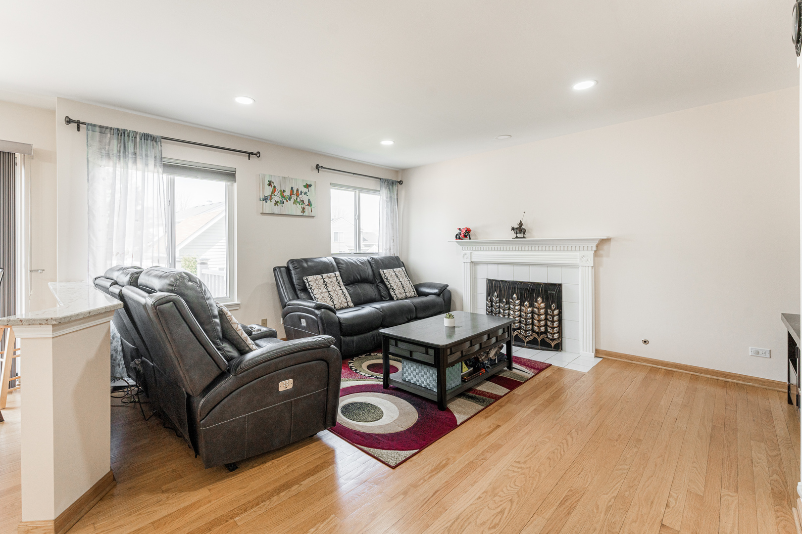 341 Sundance Drive Bartlett, IL 60103 - Photo 13 of 40 a living room with furniture and a fireplace