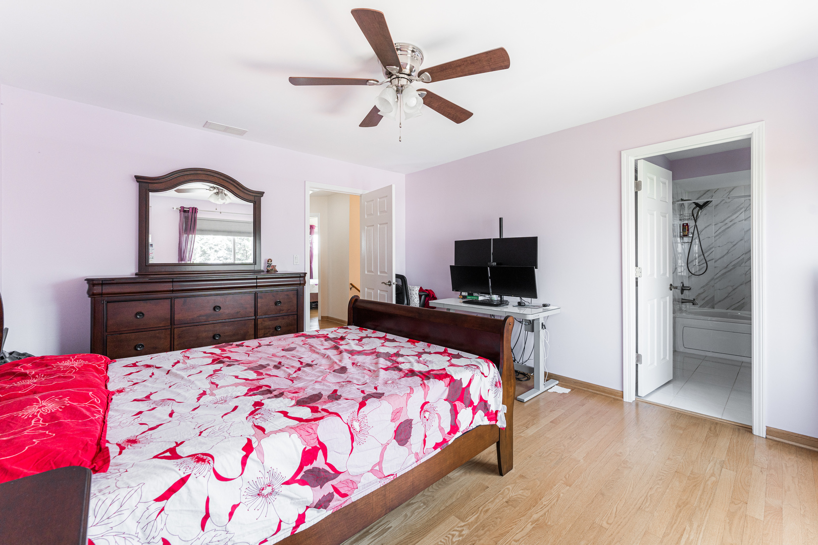 341 Sundance Drive Bartlett, IL 60103 - Photo 21 of 40 a bedroom with a bed and a flat screen tv