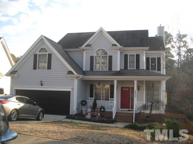 6613 Mafolie Court Raleigh, NC 27613 - Photo 1 of 8 a front view of a house with a yard