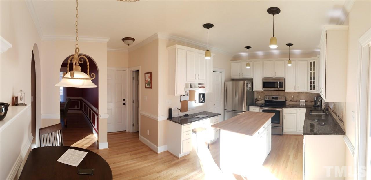 6613 Mafolie Court Raleigh, NC 27613 - Photo 2 of 8 a very nice looking room with a large window