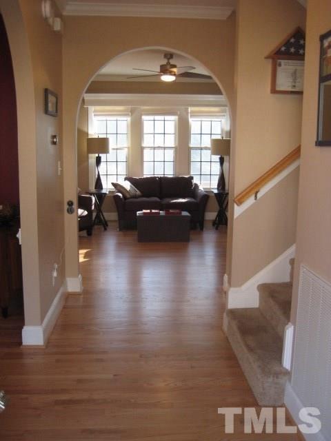 6613 Mafolie Court Raleigh, NC 27613 - Photo 5 of 8 a living room with furniture and a large window