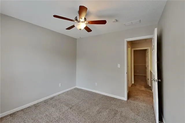 a view of a livingroom with a ceiling fan