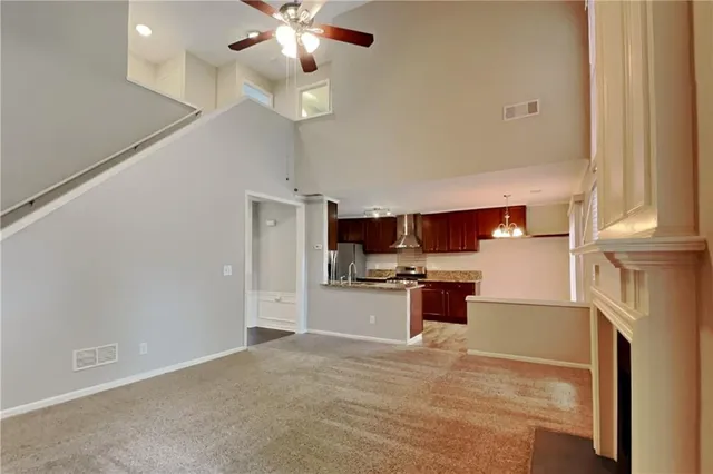 a large kitchen with cabinets and stainless steel appliances